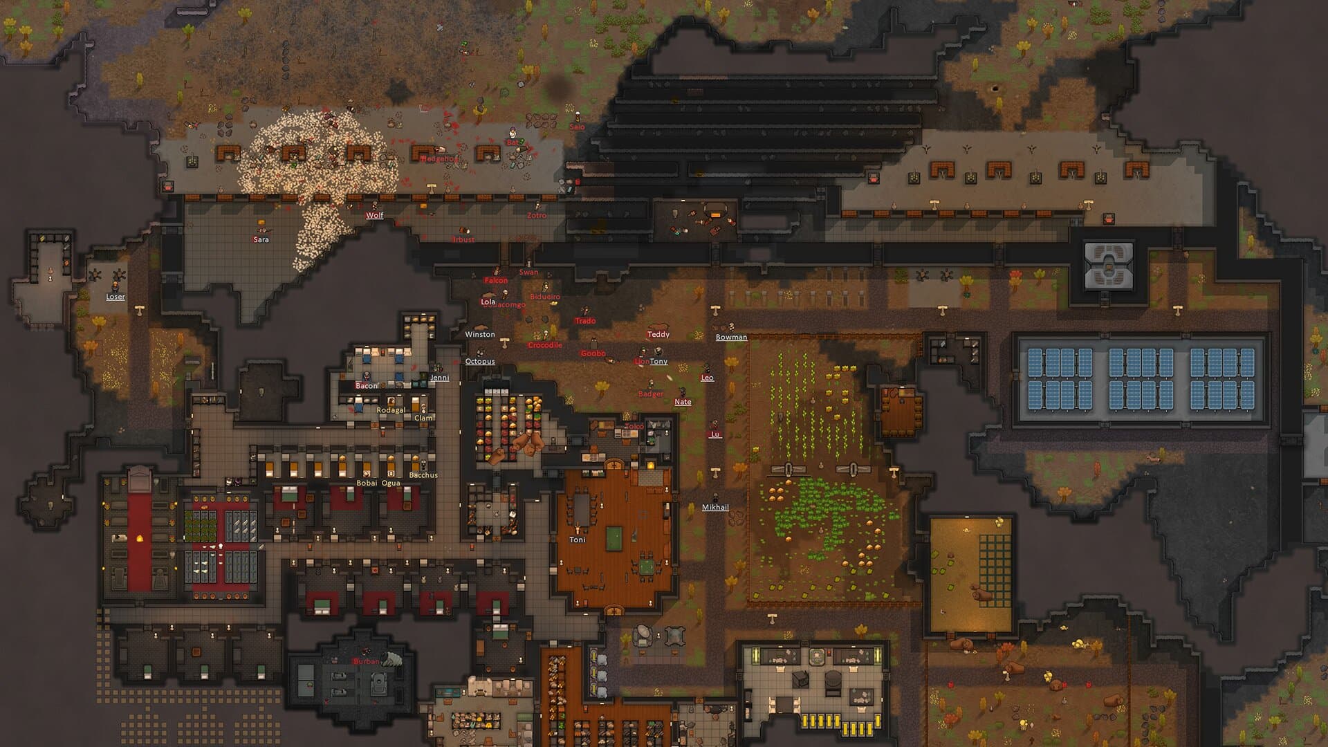 An overhead view of a RimWorld colony with farms, bedrooms, workshops and solar panels.