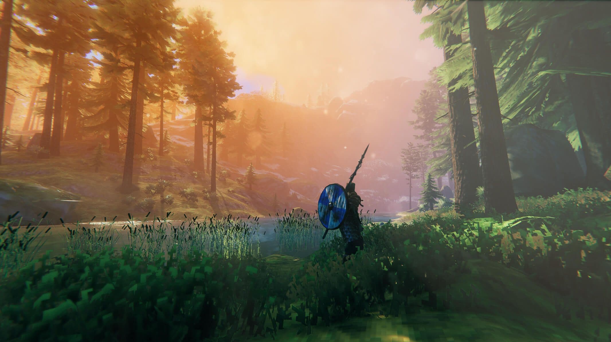 A Viking carrying a spear and round shield walks through a sunlit Valheim forest.