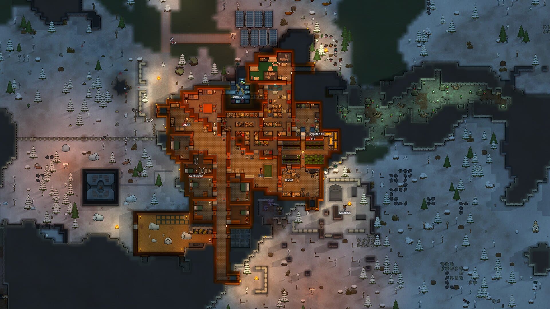 A RimWorld settlement surrounded by boreal forest in an official promotional screenshot.